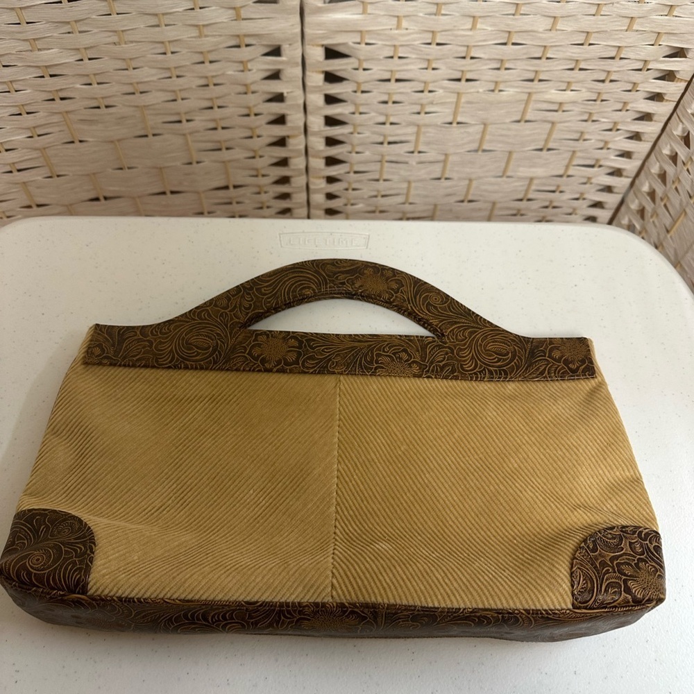 Clutch/purse corduroy/leather. Inside pockets. Unused.‎ Tag is CLN